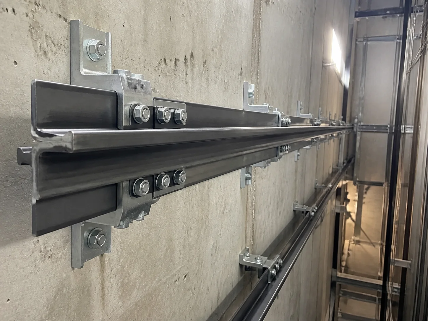Precision machined elevator guide rails